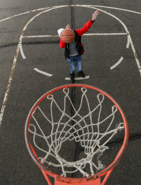 istock Teen boy playing Basket ball hoop 1139774801