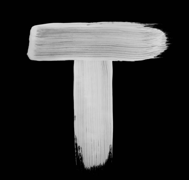 Paint brush Stroke Letter T Paint brush stroke of letter, isolated on a black background. High detailed macro studio photographed handwriting. pics of a letter t in cursive stock pictures, royalty-free photos & images