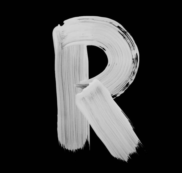 Paint brush Stroke Letter R Paint brush stroke of letter, isolated on a black background. High detailed macro studio photographed handwriting. brush stroke alphabet stock pictures, royalty-free photos & images