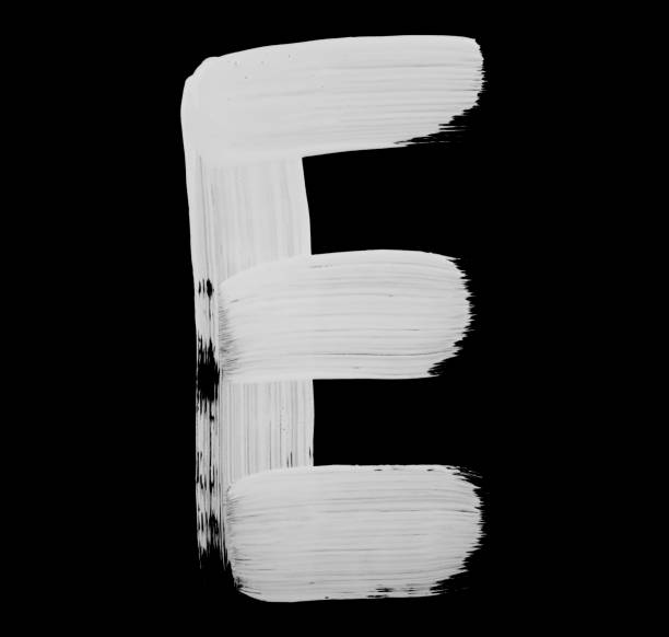 Paint brush Stroke Letter E Paint brush stroke of letter, isolated on a black background. High detailed macro studio photographed handwriting. capital letter photos stock pictures, royalty-free photos & images