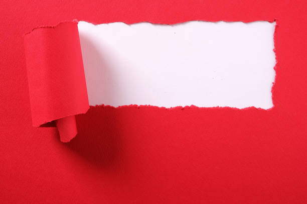 istock Torn red paper strip curled edge border white background 1139778276