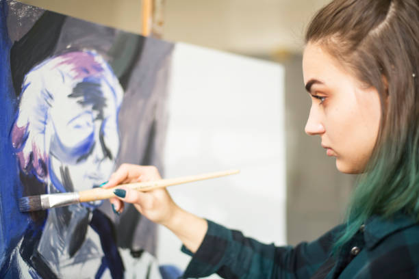 istock Young artists, students are painting in the studio. 1139779177