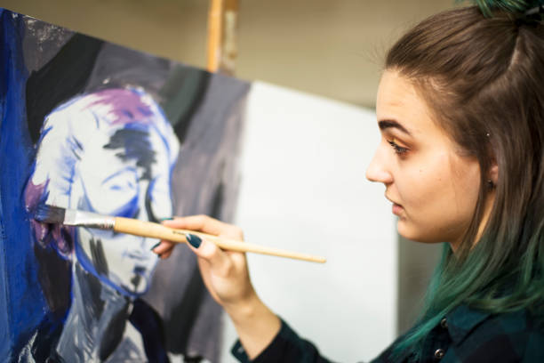 istock Young artists, students are painting in the studio. 1139779180