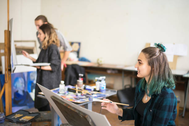 istock Young artists, students are painting in the studio. 1139779189