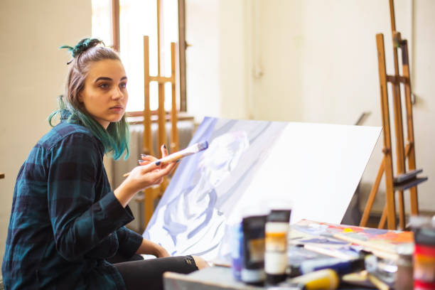 istock Young artists, students are painting in the studio. 1139779196