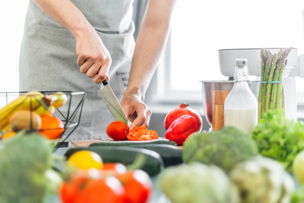 istock Young man chef cooking healthy salad 1139779270