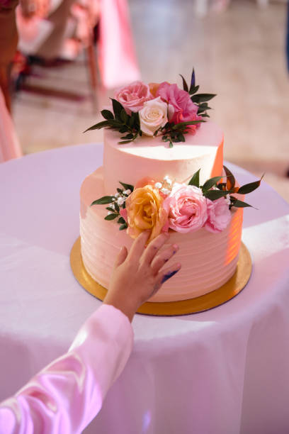 istock A child's hand leaning toward the wedding cake in ecological natural style 1139779384