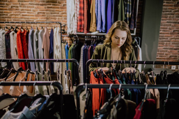 istock Woman looking for clothes in the store 1139779583