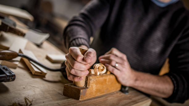 istock Close-up of a carpenter using a hand plane 1139780400