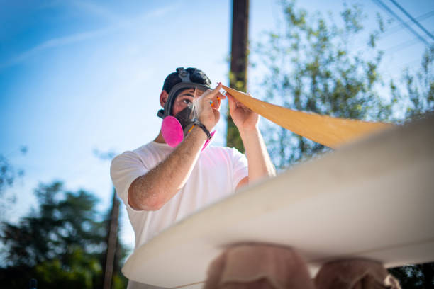Young Entrepreneur Crafting A Custom Surfboard