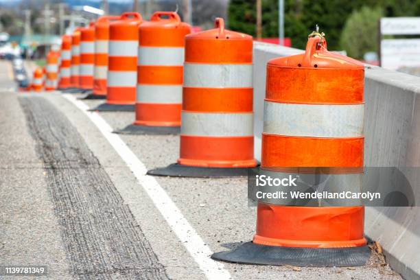 Traffic Barrels With Shallow Depth Of Field Stock Photo - Download Image Now - Road Construction, Construction Site, Highway