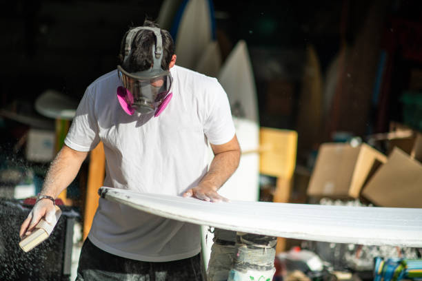 istock Young Entrepreneur Crafting A Custom Surfboard 1139781405