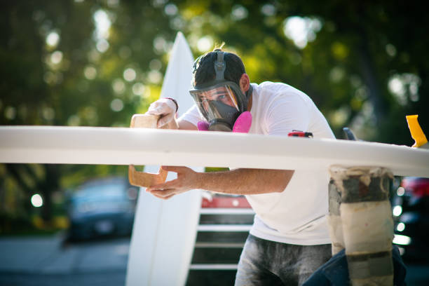 istock Young Entrepreneur Crafting A Custom Surfboard 1139781419