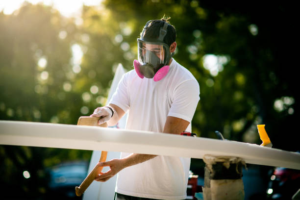 Young Entrepreneur Crafting A Custom Surfboard