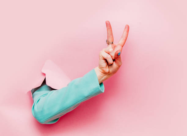 istock Female hand in classic blue jacket show Ok symbol 1139781506