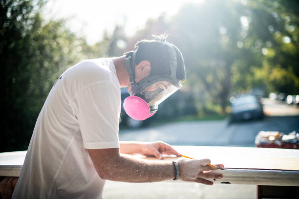 istock Young Entrepreneur Crafting A Custom Surfboard 1139781625