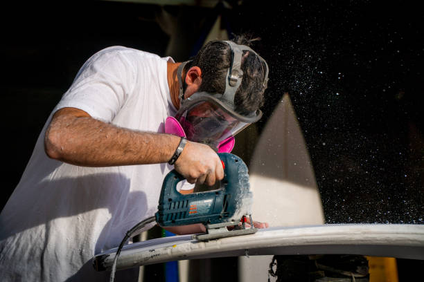 istock Young Entrepreneur Crafting A Custom Surfboard 1139782360