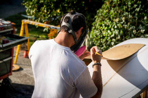 Young Entrepreneur Crafting A Custom Surfboard