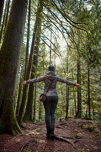 Shoot of young beautiful woman hiking in the forest