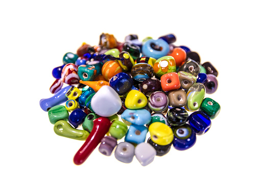 Collection of colorful glass beads. Colored Venetian, Murano glass, millefiori. Isolated on white background. Flat lay, top view