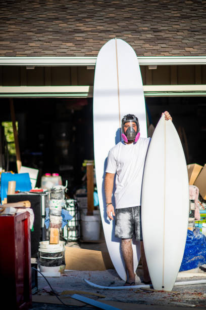 istock Young Passionate Entrepreneur Showing Off His Completed Custom Surfboards 1139785433