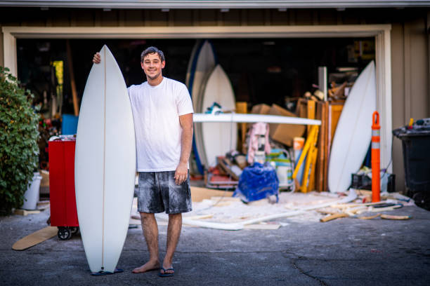 Young Passionate Entrepreneur Showing Off His Completed Custom Surfboard