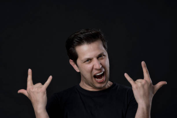istock Man showing rock and roll gesture 1139786658