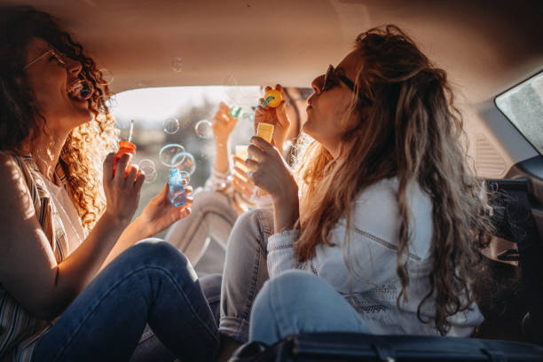 istock Three young woman blowing soap bubble 1139786665