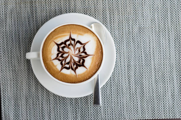 istock Hot latte art in white coffee cup from top view 1139788404
