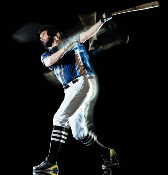 istock baseball player man isolated black background light painting 1139789428