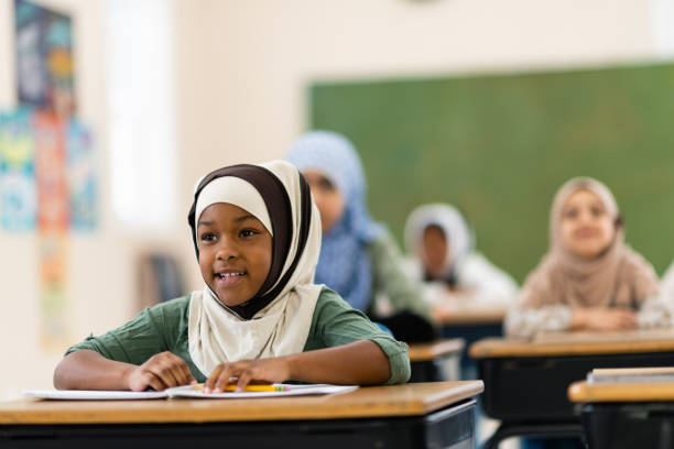 istock Muslim girls sitting in class 1139790273