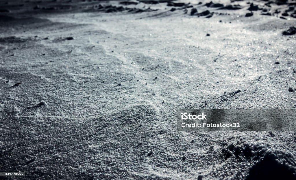 The texture of the lunar surface. The texture of the lunar surface. Mysterious patterns, mystery and lack of knowledge Moon Stock Photo