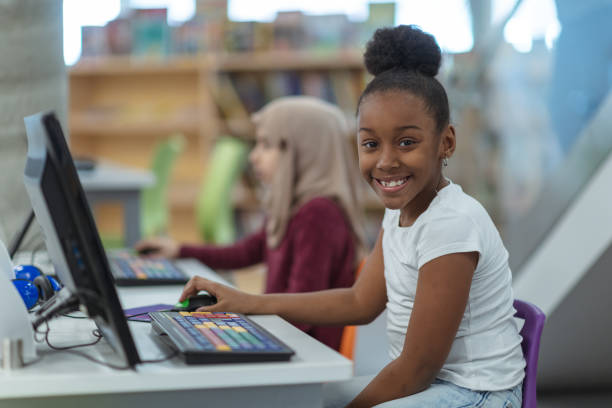 istock Smiling computer girl portrait 1139790955