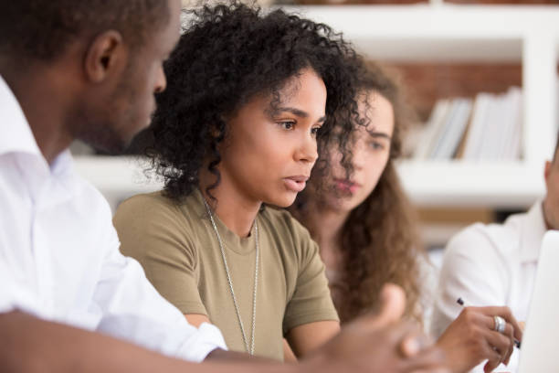 istock African teacher team leader speaking explaining online work to employees 1139791174