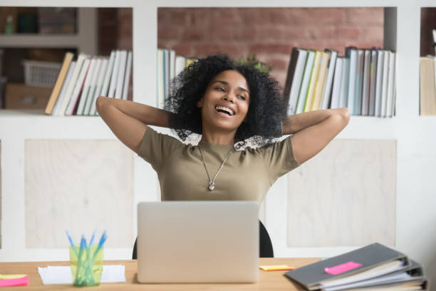 istock Happy relaxed african american female worker satisfied with finished work 1139791235