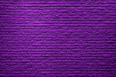 Violet brick wall background. Halloween day background.