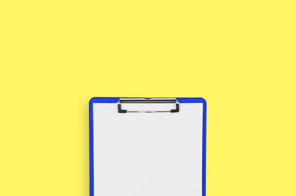 istock One blue plastic clipboard with glossy chrome clamp and white blank paper sheets on yellow office table. Top view. Business, education or medical concept. Copy space 1139792262