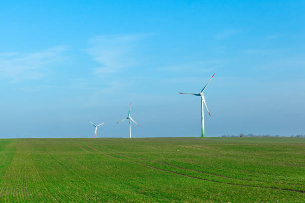 istock wind generators in a field on a clear sunny day 1139792674