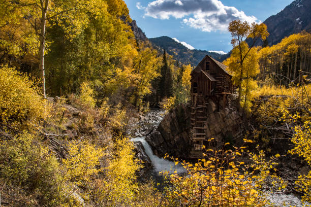 istock Old power generator mill Aspen area 4x4 road through aspen trees 1139796083