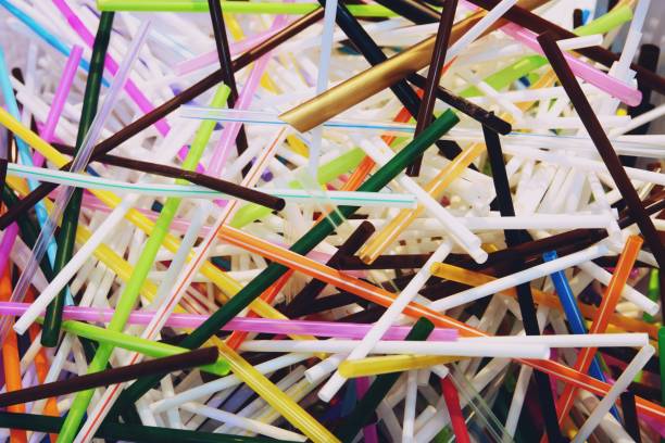 plastic box with donations in straw close up - drinking straw plastic design in a row imagens e fotografias de stock