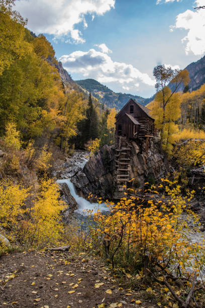 istock Old power generator mill Aspen area 4x4 road through aspen trees 1139796238