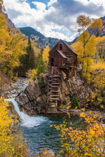 istock Old power generator mill Aspen area 4x4 road through aspen trees 1139797009