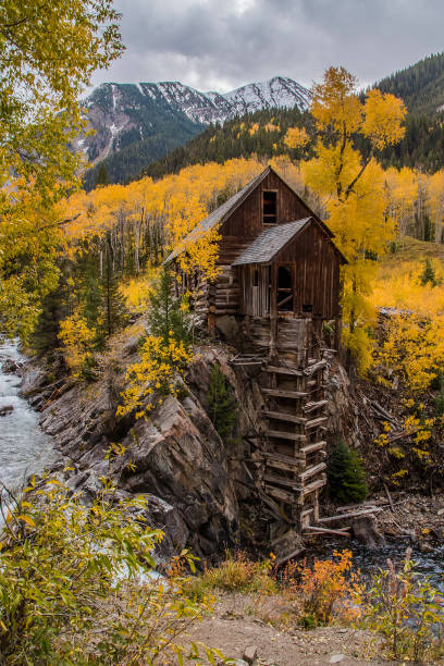 istock Old power generator mill Aspen area 4x4 road through aspen trees 1139797721