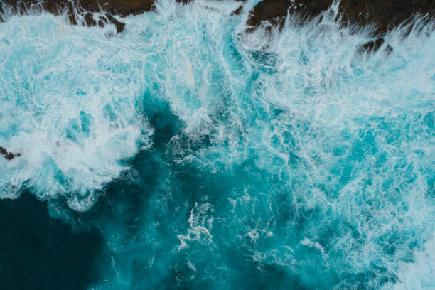 istock Aerial view of waves splashing on beach. 1139797987