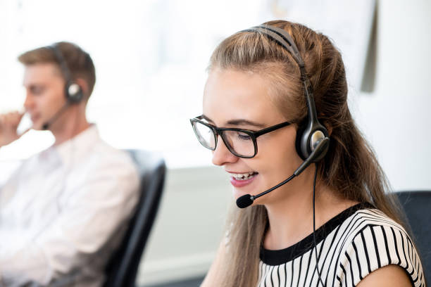 istock Friendly woman working in call center office 1139798882