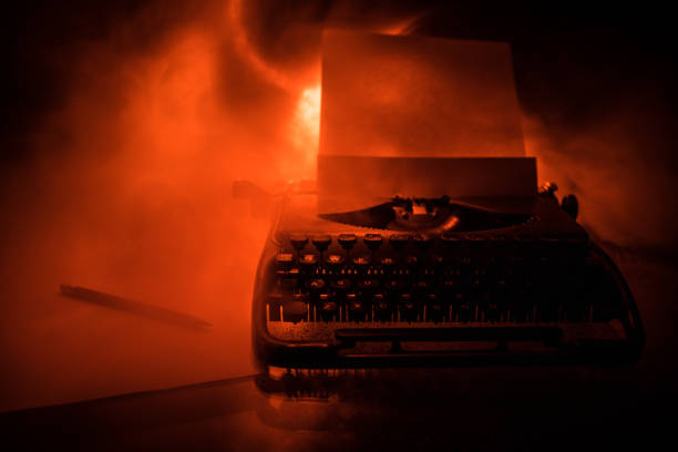 old fashion typewritter on dark foggy background. close up of vintage typewritter machine - typewriter journalist newspaper obsolete imagens e fotografias de stock