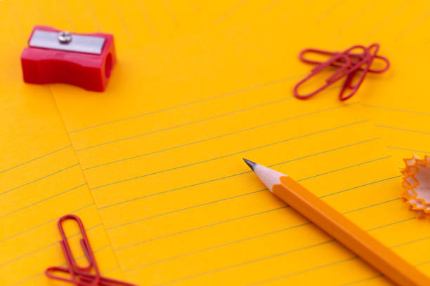 istock Concept Orange sheets of paper, pencil, stationery and empty space for your text. 1139800111