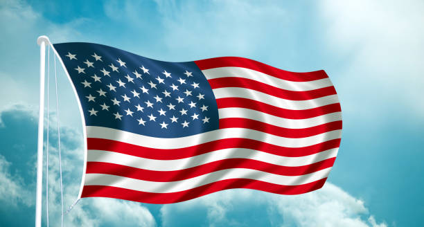 istock USA National waving  flag at blue sky cloud 1139803015
