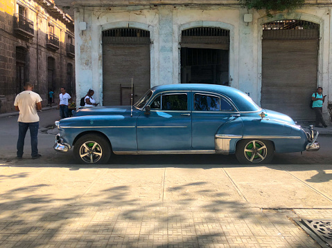 Blue classic Cuban vintage car. American classic car on the road in Havana, Cuba. Famous car used for sightseeing and taxi in Havana.