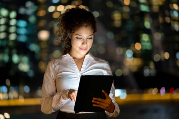 istock Business woman working at night online on a digital tablet 1139805744